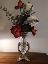 Floral arrangement in glass vase with silver holder
