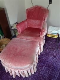 small size pink chair with foot rest. Kind of chaise lounge like