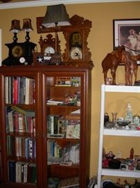 Bookcase, clocks, lamps