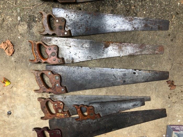 Very old saws with carved handles