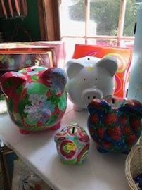 A group of hand painted piggy banks