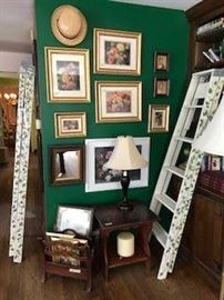 Wall full of framed prints & hand painted stepladders