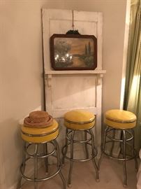 Whitewashed cypress door with shelf, wonderful old art in antique frame, set of vintage chrome Cosco swivel barstools (30”).
