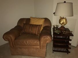 Super comfy Norwalk leather club chair, mid-century magazine table with brass inlay, great Tiger lamp with linen shade.