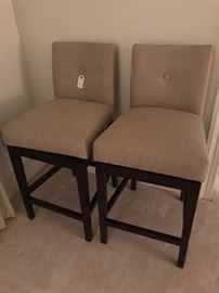 Pair of swivel upholstered barstools less than a year old.