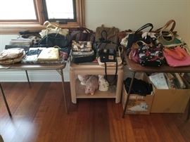 Large assortment of handbags