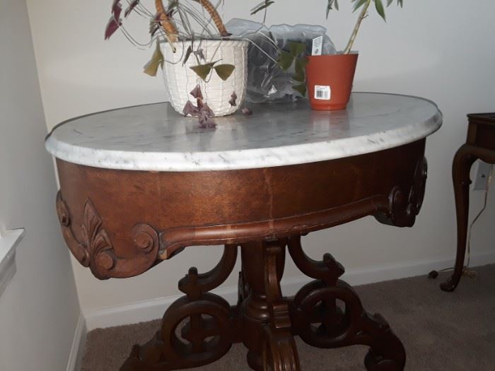 Antique marble topped ornate oval occasional table in great condition.