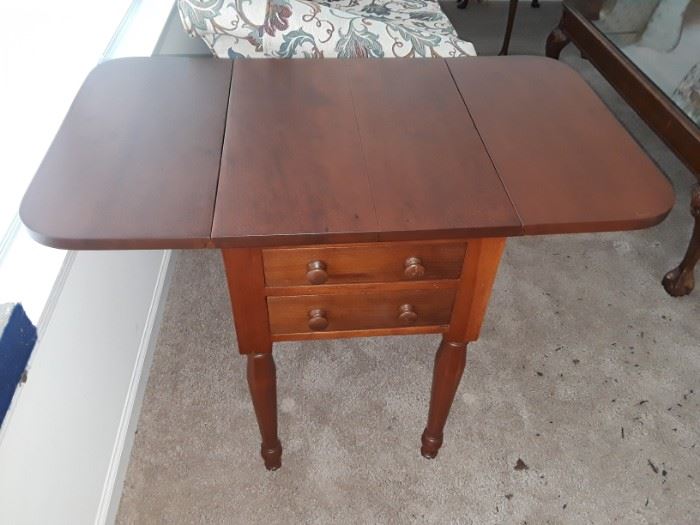 Professionally refinished antique two drawer side table with wings.