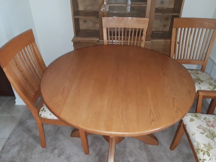 Oak dining set with two leaves not pictured. 