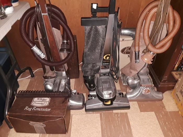 Multiple generation Kirby vacuums. 