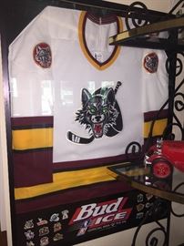 FOR HIS MANCAVE: COLLECTIBLE: LARGE FRAMED CHICAGO WOLVES ICE HOCKEY TEAM JERSEY W/BUD ICE. Width: 27”. Height: 35”. AWESOME GIFT!!! 