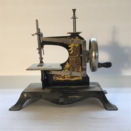 Antique Miniature Hand-Cranked Sewing Machine https://ctbids.com/#!/description/share/49427