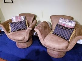 A pair of unique swivel chairs