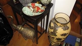 More brass decor, porcelain vases and furniture. 
