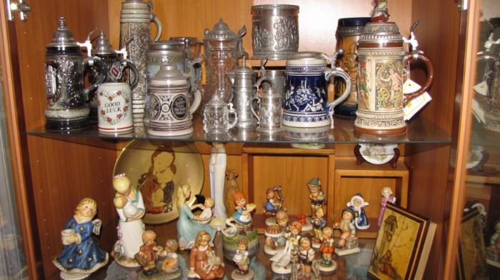 Steins, many Gerz & other German makers. Hummel collection and more. Teak wall curio.