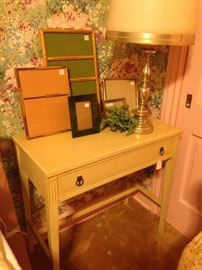 Small one drawer desk; frames; brass lamp