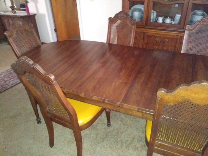 Matching dining room table with six chairs and two leaves