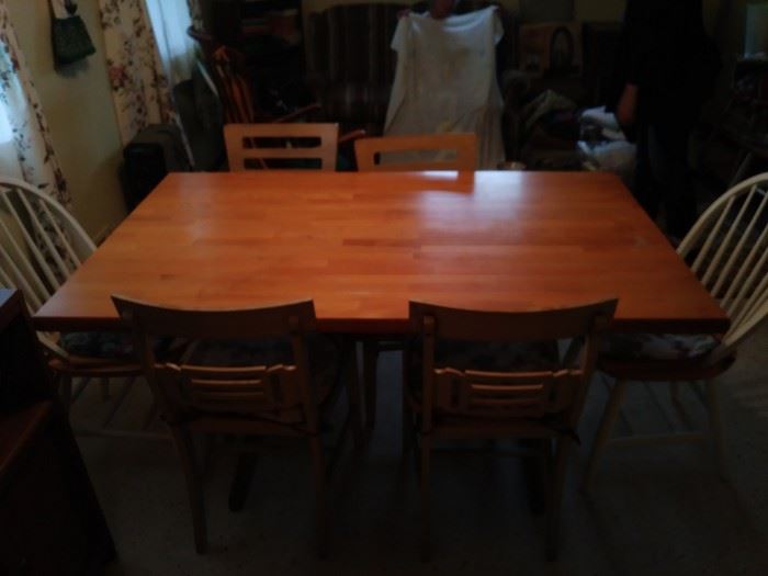 Wooden kitchen table with four matching chairs