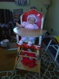 Antique highchair with vintage doll