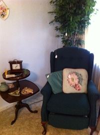 Recliner, small table, ficus tree