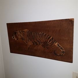 Veneer inlaid tiger on a tiger maple background
