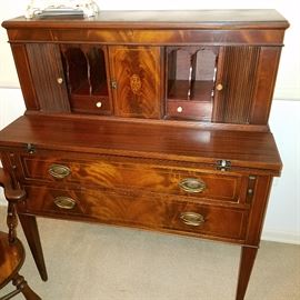 Tambour screens on a flame mahogany ladies' desk with inlay