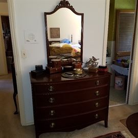 West Michigan Furniture Company Bedroom suite of dresser with mirror and 4-poster bed.