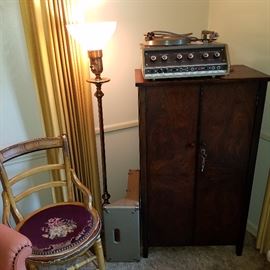 Piano roll cabinet, vintage turntable, needlepoint chair