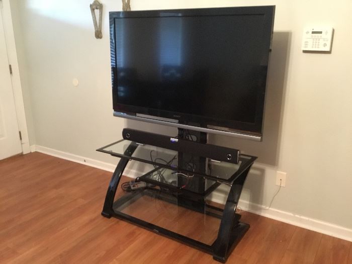 TV, TV stand and sound bar. 