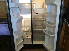 Kenmore Side by Side refrigerator with ice and water in door with doors open. 
