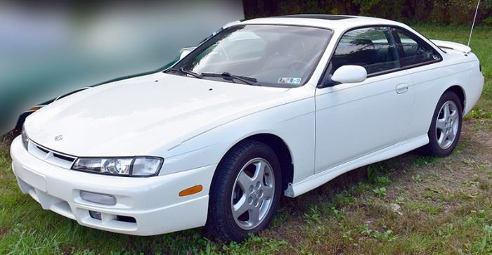 8PM: Estate Auto | 1997 Nissan 240SX SE Coupe with 32,556 Miles; 5-speed Manual Transmission; Power Moonroof; Power Locks, Windows, Mirrors; AM/FM Stereo with Cassette; White Exterior, Black/Gray Sport Cloth Interior, and more. VIN: JN1AS44D6VW100808