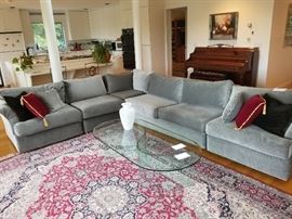 Versatile 4 or 5 piece sectional. Full size it is 134 x 104.  Large armless section can be removed to make it 74x104