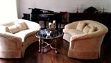 Pair of custom loveseats and bronze/glass coffee table