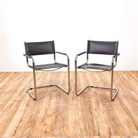 PAIR OF BLACK LEATHER & METAL ARMCHAIRS