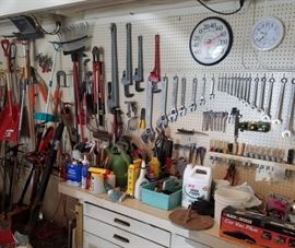 Assorted hand tools and garden implements