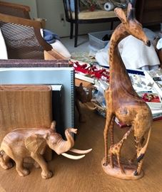 Several carved elephant bookends and exquisite mother and baby giraffes