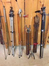 Collection of camera tripods.