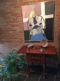 Antique drop leaf cherry night table. Framed art by Nancy Bacon.