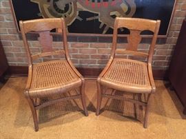 Two tiger maple caned chairs.