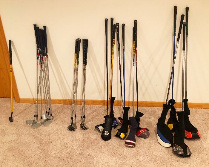Several sets of golf clubs. Callaway, Cobra, Mizuno, Taylormade, PING