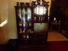 Victorian cheery secratery with curved glass front and bevled glass mirror