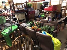 Some theater seats that will hopefully be gone soon so I have more space, but if not, they are only $10 each, two sets of three and one set of four. Couple of boxes underneath an ikea table, couple of end tables on top of ikea table and a bunch of small things all over.