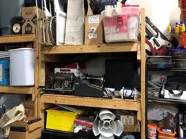 Old Adding machine and old sewing machines, not working, so best for décor. A bin of sandpaper belt stlye on top.