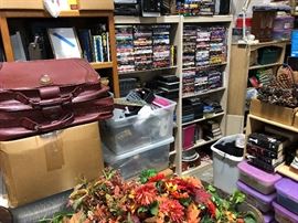 Tons of movies and interesting things on shelves.