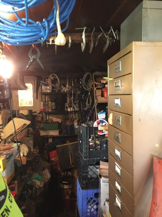 Garage-cabinet, tile cutter clamps 
Rakes, etc etc