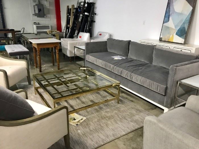 BRASS FINISH MITCHEL GOLD COCKTAIL TABLE ALONG WITH GREY VELVET MINT MG SOFA. CHAIRS ARE SOLD 