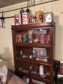Antique barrister bookcase, antique colorful tins, Reds collectibles