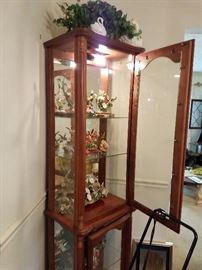 Curio Cabinet with Hummingbird Figurine Collection.