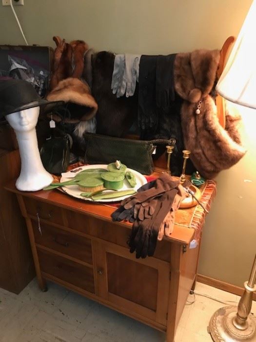 Dresser sets, fur stoles and hats.  Beautiful furniture as well.