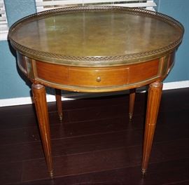 Leather top table with brass rail